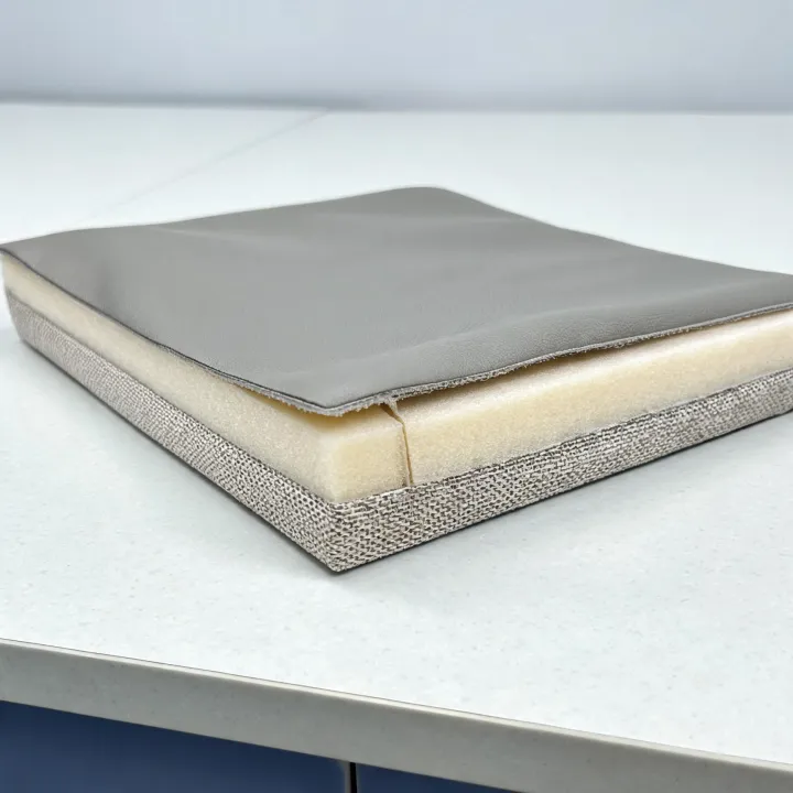 Coated fabric edge revealing textile backing